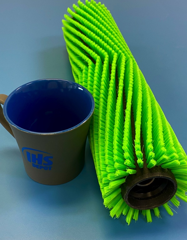 A cup and a roller brush on the table